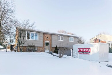 This split entry home has a large driveway with a 