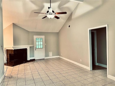 Living area with cathedral ceilings & fireplace