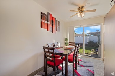 Dining area with baseboards and a ceiling fan