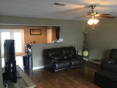 Living room opens to kitchen.  