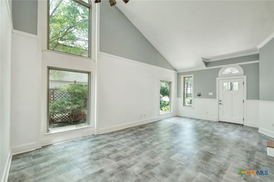Living Room & Entry showcasing large windows and p