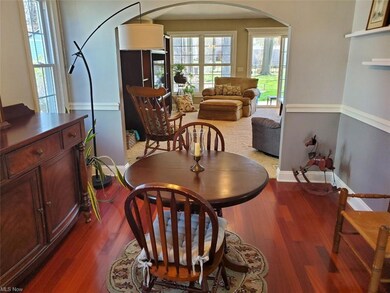 FORMAL DINING ROOM. HARDWOOD FLOOR. ARCHED OPENING