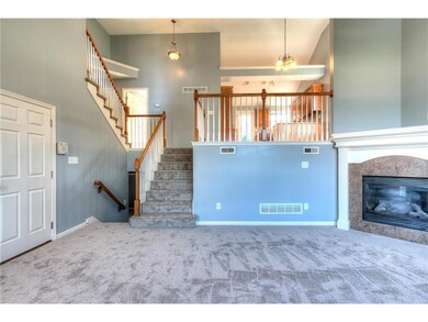 Spacious great room with corner fireplace