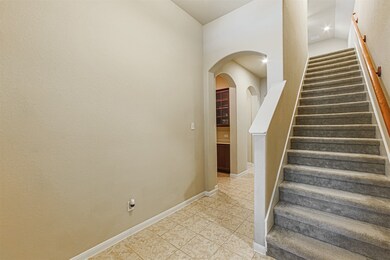 Entry features high ceilings.