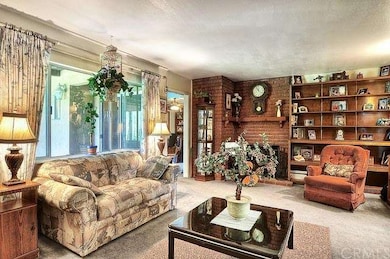 Formal living room off the entry with a wood/gas b