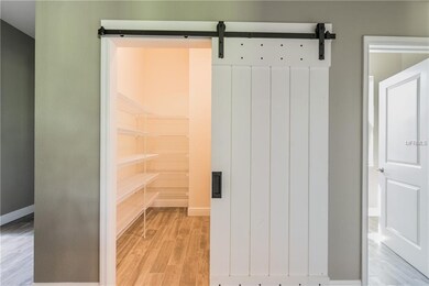 Pantry With Wooden Barn Door