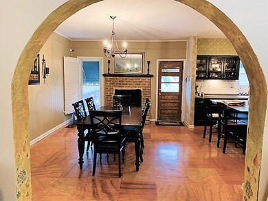 Arch Entry leads from the Living Room to  the Dini