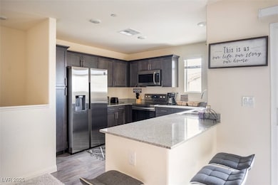 Kitchen with stainless steel appliances, a sink, a
