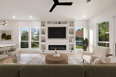 Living area with light wood-style flooring, a cei