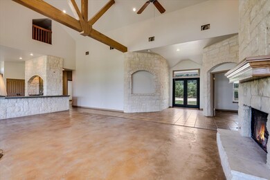 Unfurnished living room with a warm lit fireplace