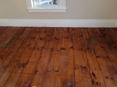 Throughout this home are wide plank pine floors ty