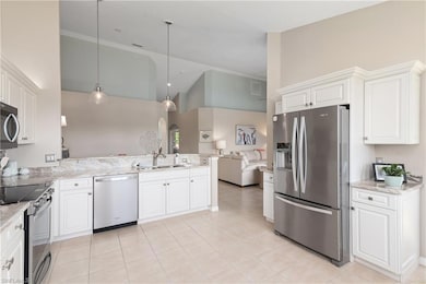 Kitchen features granite counters and stainless st