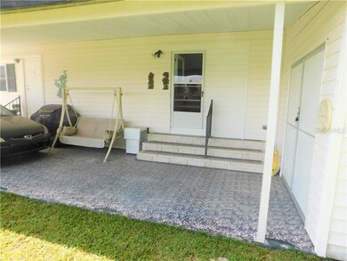 Carport entry into kitchen/dining room area.