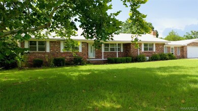 FRONT OF HOUSE AND GARAGE