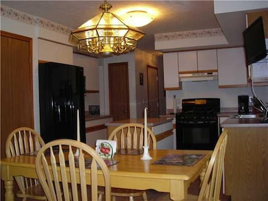 Exterior Front. Plenty of cabinetry as well as a p