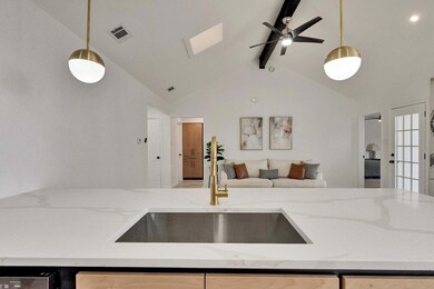 Kitchen featuring open floor plan, visible vents,