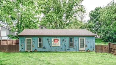 3 car garage with electric, service doors and alley access