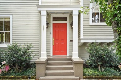Front porch and landscaped flower beds along the f