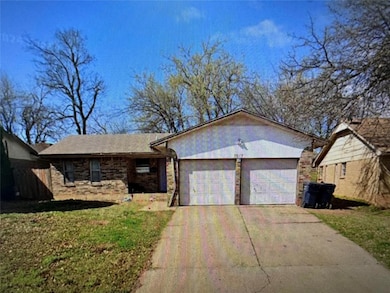 Single story home with a garage