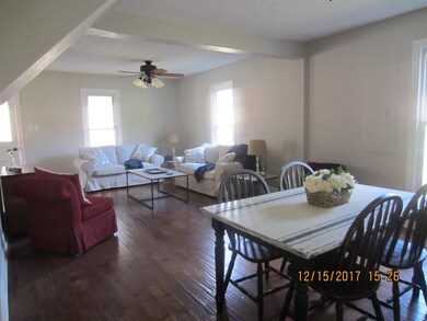 ANOTHER VIEW OF LIVING ROOM AND DINING AREA