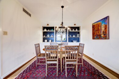 Dining Room with built-in shelving and storage spa