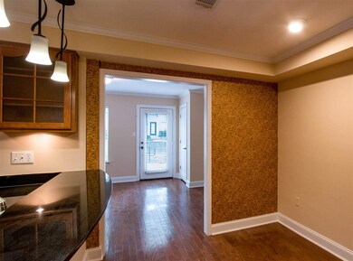 Breakfast room off the kitchen with wood floors.