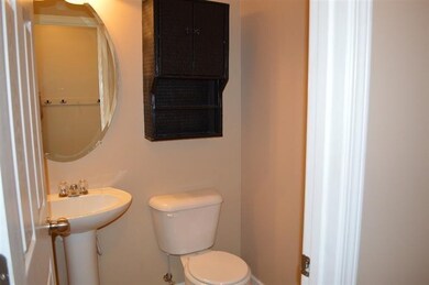 Downstairs half bath off kitchen.