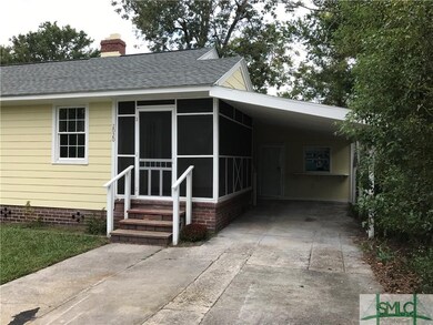 Screen in porch with covered carport and off stree