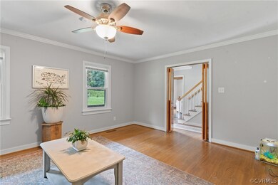 Living area with light hardwood / wood-style floor