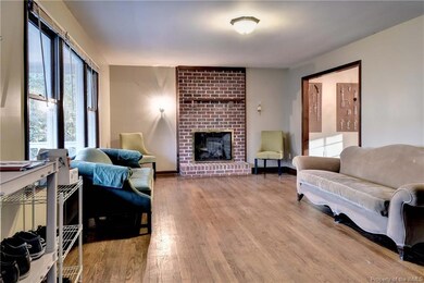 Living Room has hardwood floors and a cozy gas fir