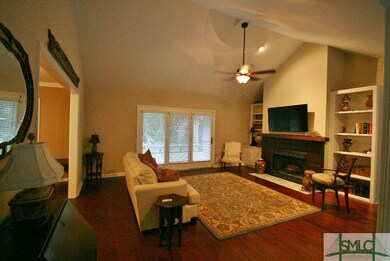 Living Room with fireplace and built-in shelving