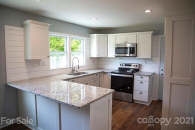 Granite countertops, new cabinets, shiplap backsplash