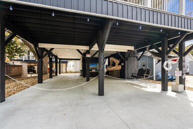 View of patio / terrace with a carport