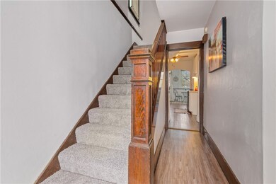 The entryway features new waterproof vinyl floorin