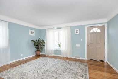 Foyer with wood-type flooring