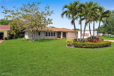 View of front of home with stucco siding and a fro
