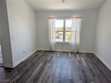 Living room with Cable TV hook up wood-style floor