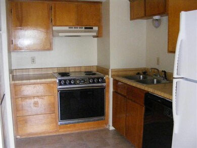 Kitchen featuring electric range, under cabinet ra