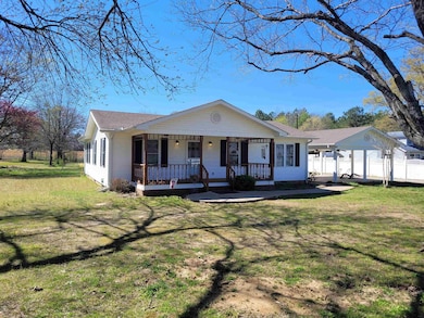 Bungalow-style house featuring a front lawn, fence
