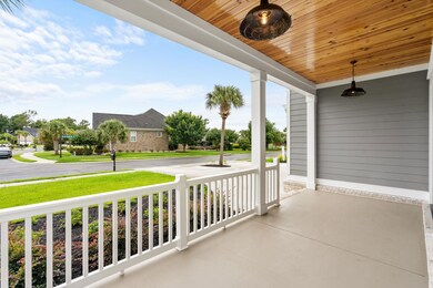 View of patio with ceiling fan and covered porch