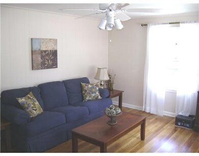 Living Room. Refinished Hardwoods and new paint