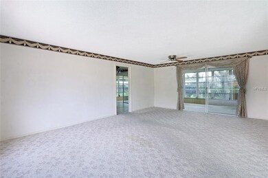 View from entrance inward through living/dining in