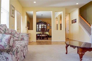 The formal living room opens to the formal dining 