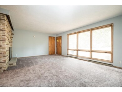 Spacious living room with new paint and new carpet