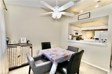Dining room featuring a ceiling fan, carpet floori