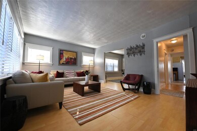 Living room with light hardwood / wood-style flooring