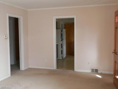 Front door on right. Doorways entering into the ki