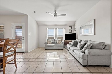 Open living room with a ceiling fan and lots of na