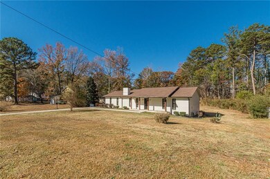 View of front of property with a porch and a front yard