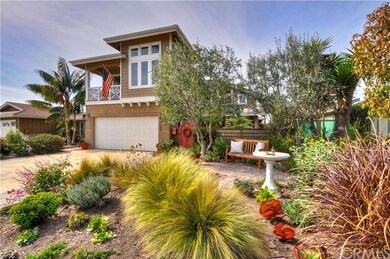 Charming home with brick walkway and succulents in